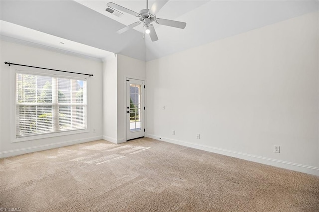 unfurnished room with ceiling fan, light colored carpet, visible vents, vaulted ceiling, and baseboards