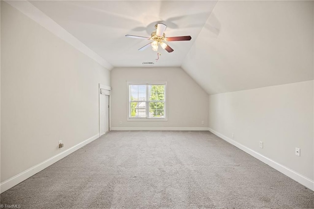 bonus room featuring baseboards, ceiling fan, and carpet