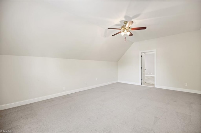 bonus room with baseboards, ceiling fan, vaulted ceiling, and carpet floors