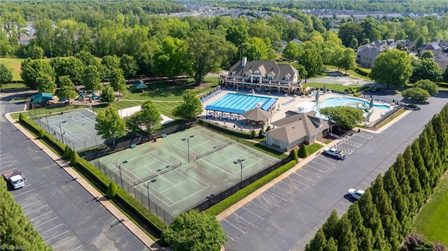 birds eye view of property with a wooded view