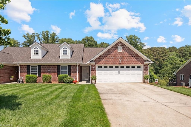 149 Royal View Dr Unit 1, Pinnacle, NC 27043 - view of front facade featuring brick siding, a front yard, a garage, driveway, and roof with shingles