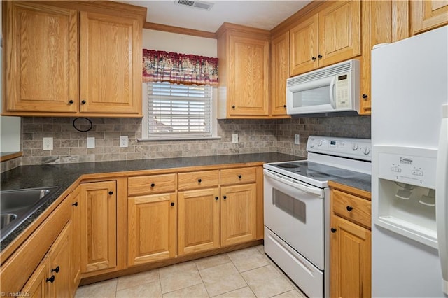 149 Royal View Dr Unit 1, Pinnacle, NC 27043 - kitchen featuring white appliances, dark countertops, decorative backsplash, light tile patterned floors, and crown molding