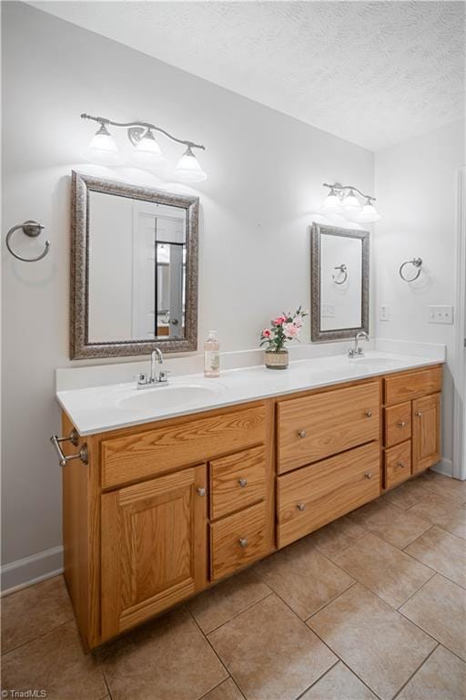 149 Royal View Dr Unit 1, Pinnacle, NC 27043 - full bath with double vanity, a textured ceiling, tile patterned flooring, and baseboards