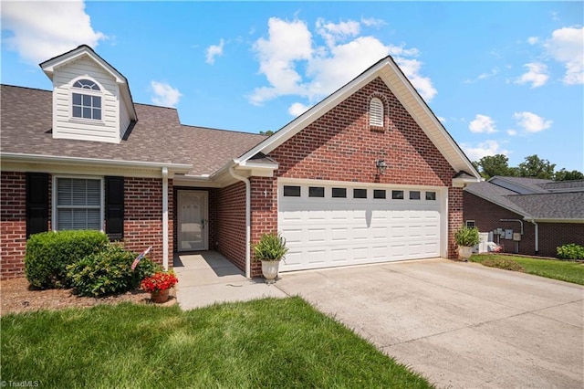 149 Royal View Dr Unit 1, Pinnacle, NC 27043 - view of front of house with brick siding, driveway, a garage, a shingled roof, and a front lawn