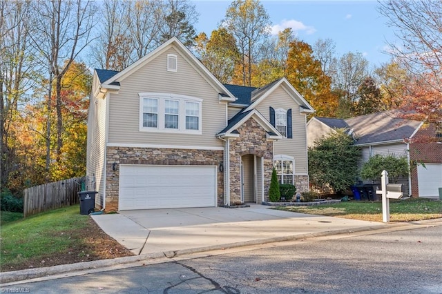 front of property featuring a front lawn and a garage