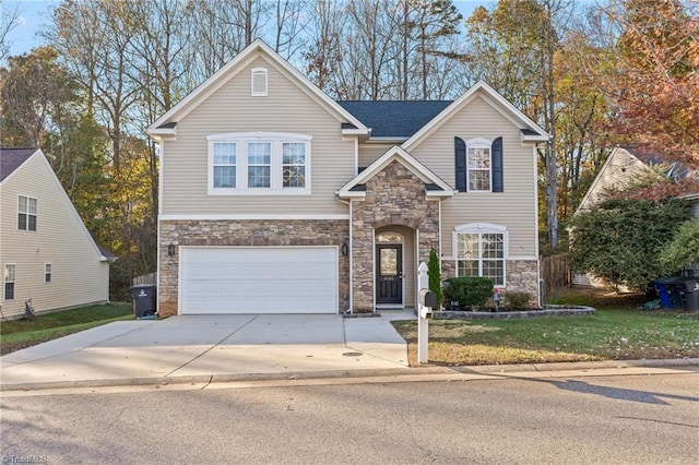 view of front facade with a front yard and a garage