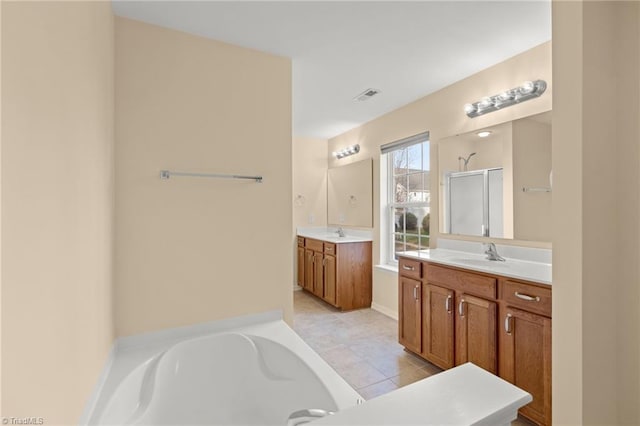 bathroom featuring tile patterned flooring, vanity, and independent shower and bath