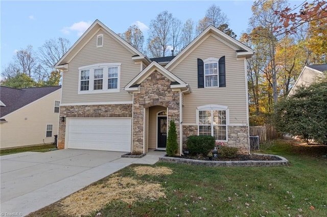 view of front of home featuring a front lawn and a garage