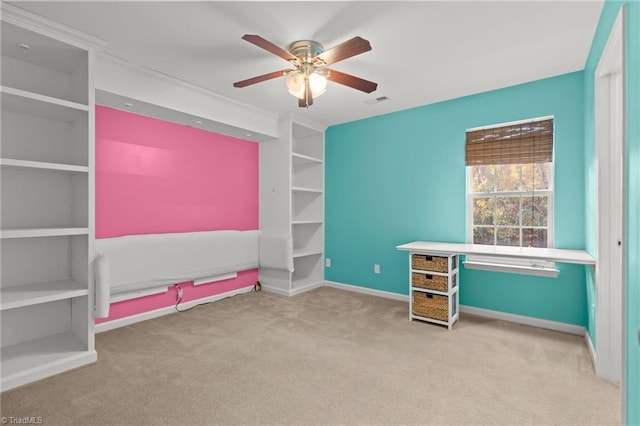 unfurnished office with light colored carpet and ceiling fan