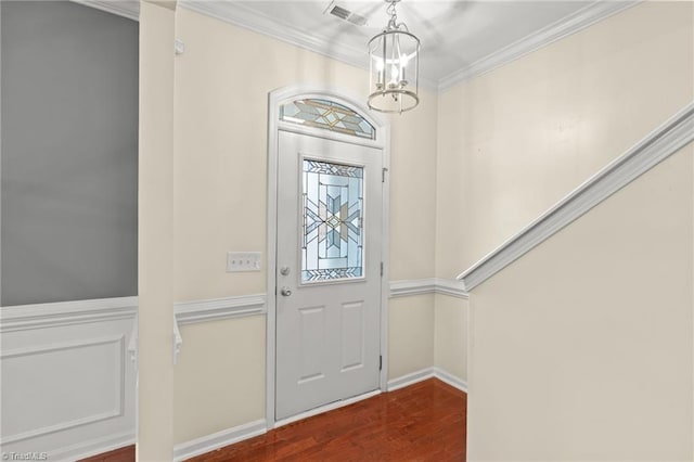 entryway with dark wood-type flooring and crown molding