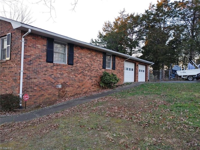 view of side of home with a garage