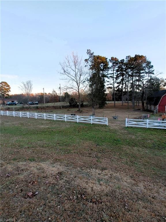 view of yard with a rural view