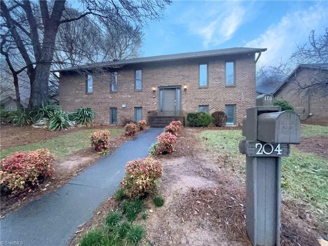 bi-level home with brick siding