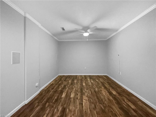 unfurnished room featuring visible vents, dark wood-type flooring, baseboards, crown molding, and ceiling fan