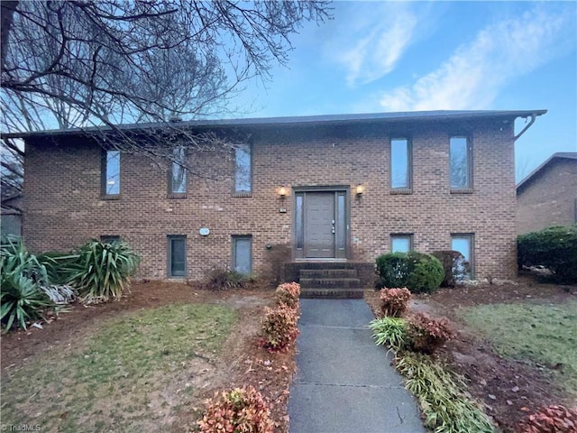 bi-level home with brick siding