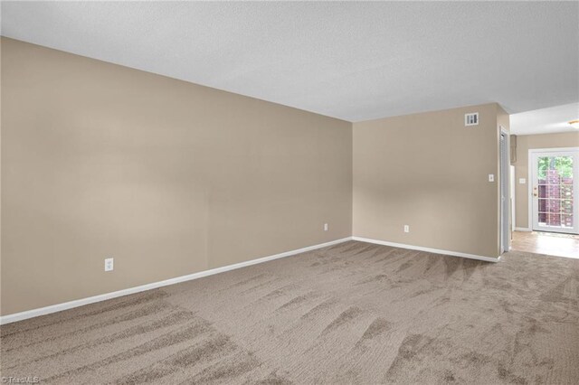 empty room featuring carpet flooring