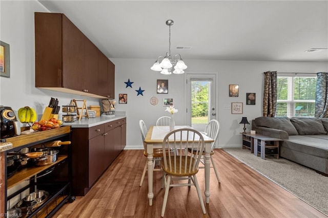 203 Cross Country Chase, Stokesdale, NC 27357 - dining area with a healthy amount of sunlight, light wood-style flooring, and visible vents
