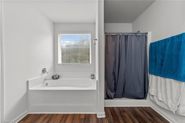 203 Cross Country Chase, Stokesdale, NC 27357 - bathroom featuring a shower with curtain, baseboards, a garden tub, and wood finished floors