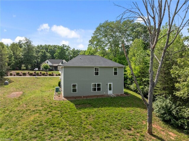 203 Cross Country Chase, Stokesdale, NC 27357 - rear view of house featuring a lawn