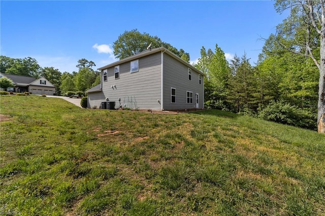 203 Cross Country Chase, Stokesdale, NC 27357 - view of home's exterior featuring central air condition unit and a lawn