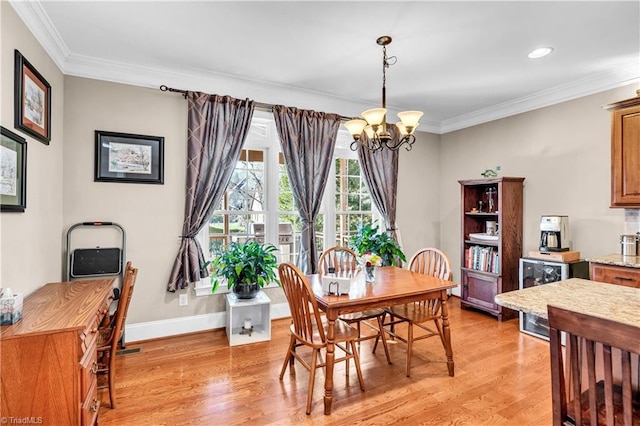 dining room with ornamental molding, light hardwood / wood-style flooring, beverage cooler, and a notable chandelier