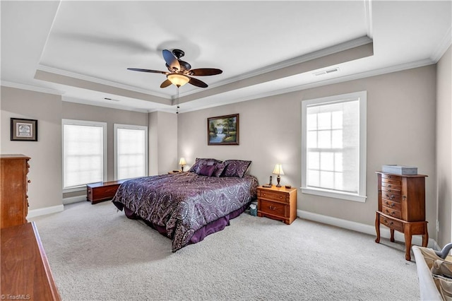 bedroom featuring light carpet, a raised ceiling, ceiling fan, and ornamental molding