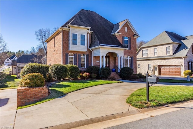 front facade featuring a garage and a front yard