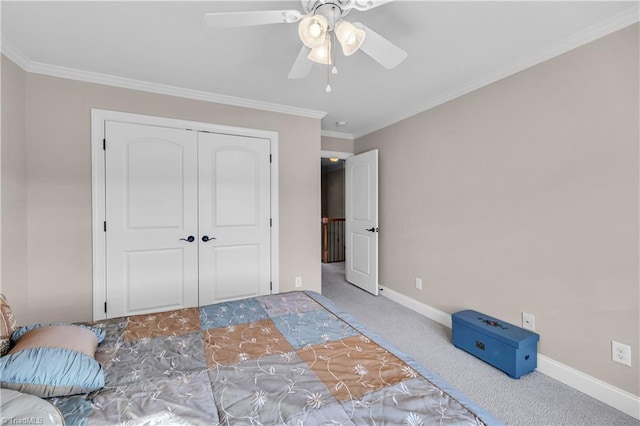 unfurnished bedroom featuring carpet flooring, ceiling fan, a closet, and ornamental molding