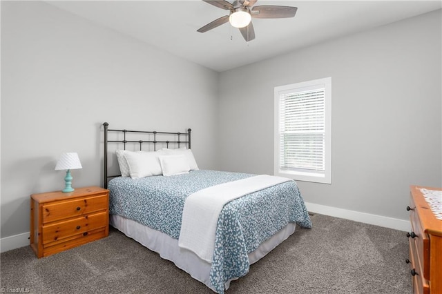 carpeted bedroom featuring baseboards and a ceiling fan