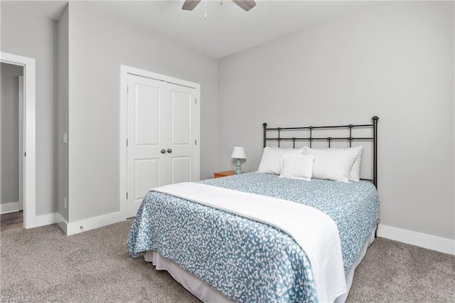 carpeted bedroom with a ceiling fan, baseboards, and a closet
