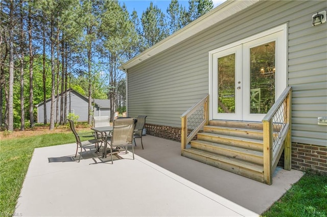 view of patio / terrace featuring entry steps and outdoor dining space