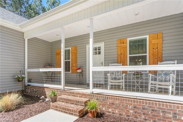 property entrance with covered porch