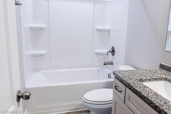 full bathroom featuring vanity, shower / bathtub combination, and toilet