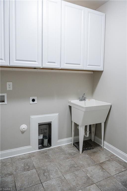 laundry room featuring cabinets, hookup for a washing machine, and hookup for an electric dryer