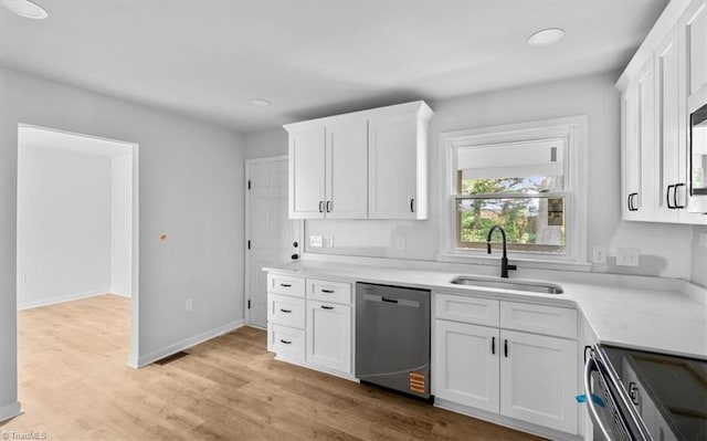 1710 Scarborough Rd, High Point, NC 27265 - kitchen with stainless steel appliances, white cabinetry, light countertops, light wood finished floors, and recessed lighting
