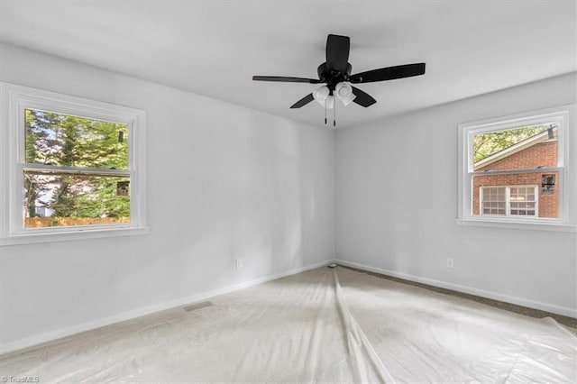 1710 Scarborough Rd, High Point, NC 27265 - empty room with plenty of natural light, carpet, and ceiling fan