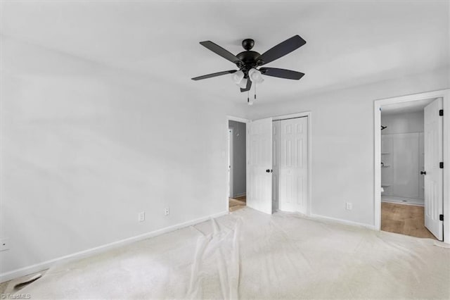 1710 Scarborough Rd, High Point, NC 27265 - unfurnished bedroom featuring carpet floors, ensuite bath, a ceiling fan, and a closet