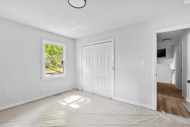 1710 Scarborough Rd, High Point, NC 27265 - unfurnished bedroom featuring a closet and attic access
