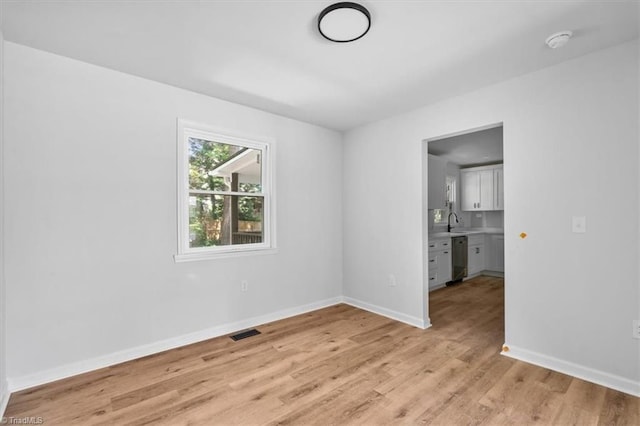 1710 Scarborough Rd, High Point, NC 27265 - empty room featuring a smoke detector and light wood-style flooring