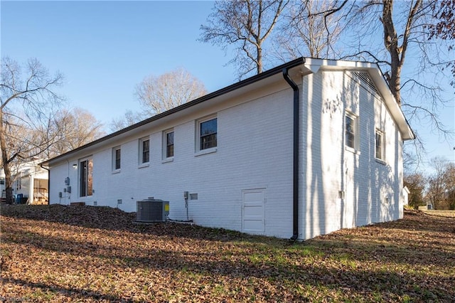 view of side of home featuring cooling unit