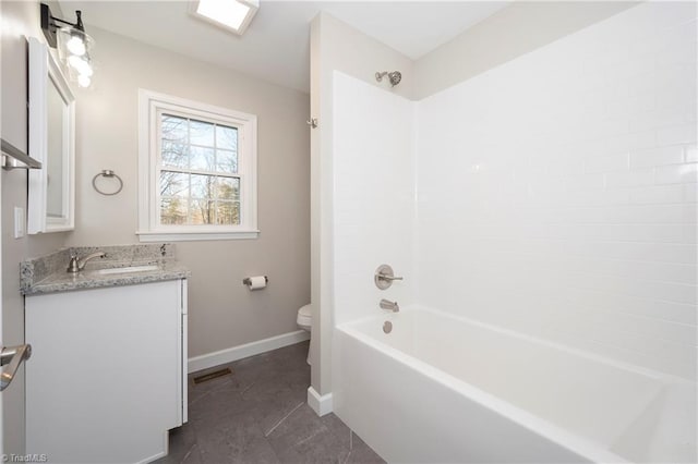 full bathroom with tile patterned floors, vanity, shower / bath combination, and toilet