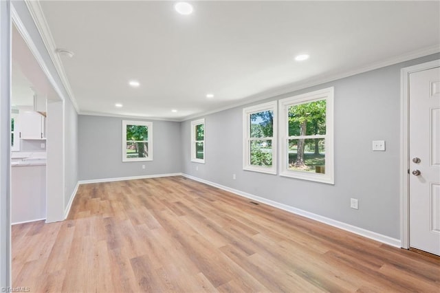 5403 Southmont Dr, Julian, NC 27283 - unfurnished living room with ornamental molding, recessed lighting, and light wood finished floors
