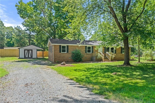 5403 Southmont Dr, Julian, NC 27283 - ranch-style house featuring a storage shed, brick siding, and crawl space