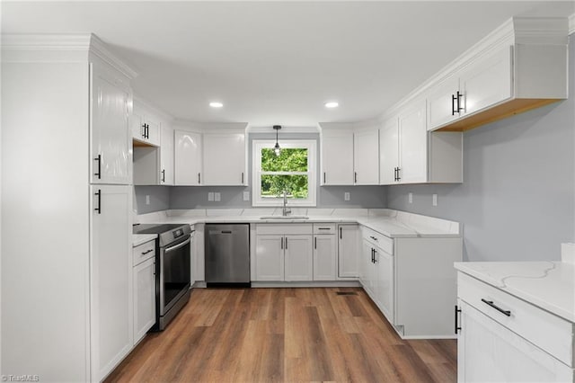 5403 Southmont Dr, Julian, NC 27283 - kitchen featuring stainless steel appliances, light stone counters, dark wood-type flooring, white cabinets, and recessed lighting