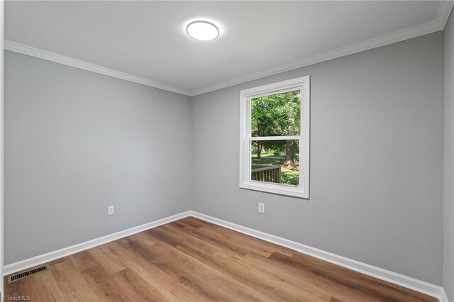 5403 Southmont Dr, Julian, NC 27283 - empty room with crown molding and wood finished floors