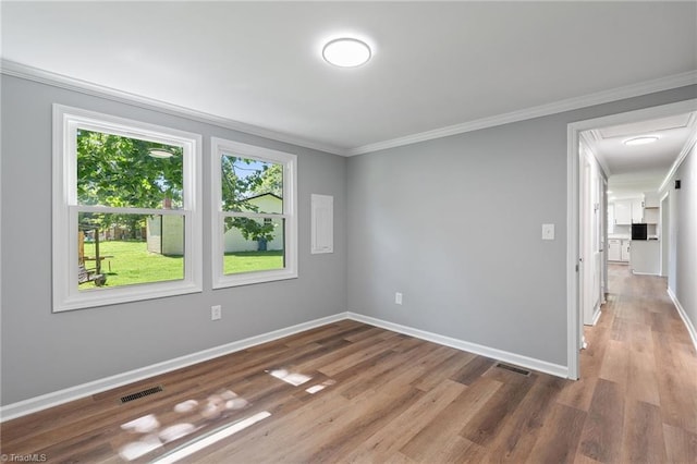 5403 Southmont Dr, Julian, NC 27283 - spare room featuring ornamental molding and wood finished floors