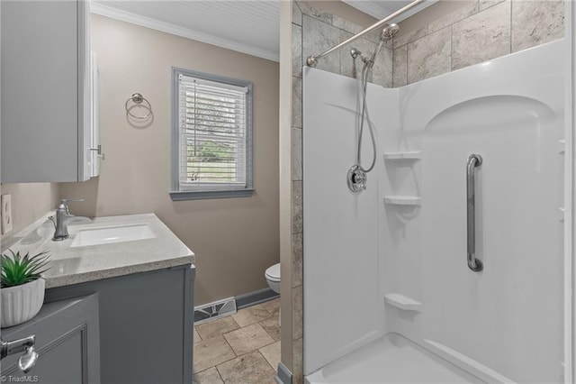 full bath featuring crown molding, toilet, vanity, a shower stall, and visible vents