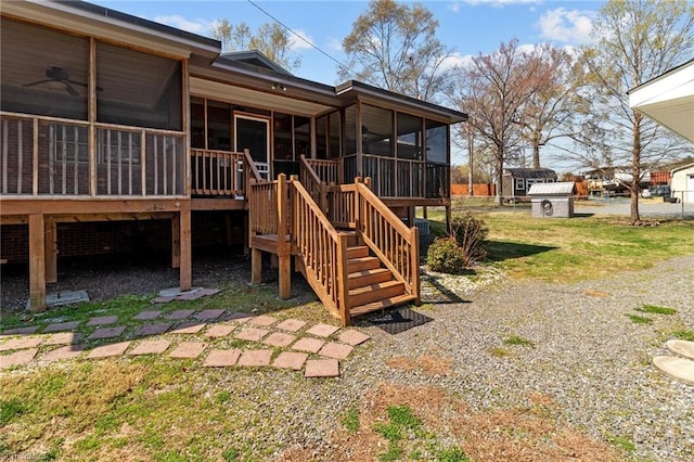 exterior space with a sunroom and stairway