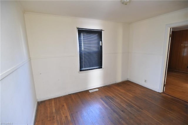 unfurnished room with dark hardwood / wood-style floors