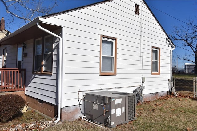 view of side of property featuring central air condition unit